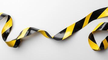 curving caution tape Yellow across white surface, signaling potential hazard or restricted area photo