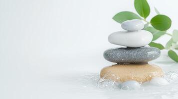 Stack of wet a pebbles with eucalyptus leaves evokes natural sense of tranquility and balanced wellness photo