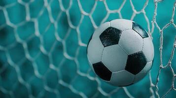 dynamic soccer ball piercing goal net, White blue toned background capturing scoring moment during intense match photo
