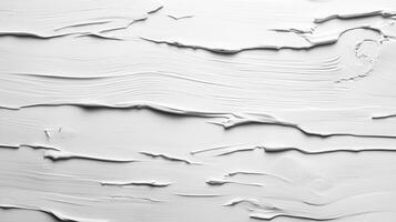 Weathered white wooden planks revealing distressed paint and raw wood grain, serving as textured vintage background surface photo