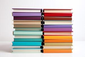 Two stacks of colorful books forming a gradient pattern photo