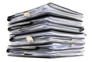 Stack of overflowing folders creating a large pile of paperwork photo