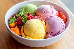 Delicious ice cream scoops with fresh fruits and mint leaves creating a colorful dessert photo