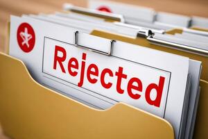 Rejected documents in hanging file folders showing unsuccessful applications photo