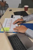 A person is using a laptop computer photo