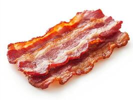Crispy bacon strips arranged on a clean white surface photo