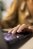 Professional manager at a multinational company works on laptop to track project progress and deadline completion. Office worker ensuring smooth task management and decision making. Close up. photo