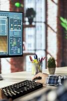 Interior designer uses architectural software to generate virtual photorealistic image renderings. Man preparing visual preview for customers after designing room with 3D modeling application photo