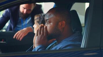 Mesmerized client unable to believe his eyes after finishing test drive and enjoying driving vehicle, deciding to buy it. Fascinated man wowed by car after trying it, ready to purchase it, camera A photo