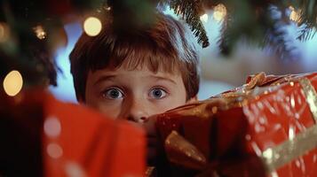 Child's excited anticipation under Christmas tree. photo