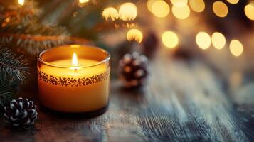Warm holiday candle with pine branches and lights. photo