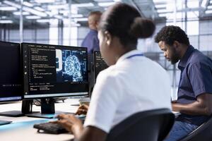 Server farm IT specialist doing AI research next to coworker, implementing algorithms using neural networks. Software developer in data center using artificial intelligence computational models photo
