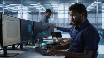 Developers in data center workspace implementing AI predictive maintenance systems. Admin in server hub office using artificial intelligence machine learning tech to identify hardware failures photo