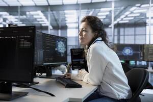 Software developer using artificial intelligence technology to optimize data center performance. Server hub specialist using AI tech to streamline operations and accurately forecast potential issues photo