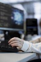 Software developer doing data center automation using AI and machine learning tools. Focus on IT employee integrating artificial intelligence driven automation in server hub operations, close up photo