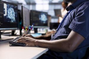 Close up of server hub expert creating AI systems high performance computing engine on PC. Software developer in data center developing artificial intelligence with cognitive abilities photo