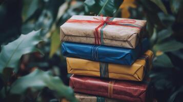 Stacked presents with colorful wrapping paper and twine. photo