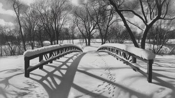Snowy winter landscape with a covered bridge and shadows. photo