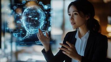 A woman interacts with a holographic projection of a head. photo
