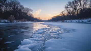 Frozen river landscape at dawn's tranquil light. photo