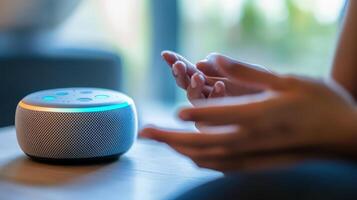 Hands interacting with a modern smart speaker. photo