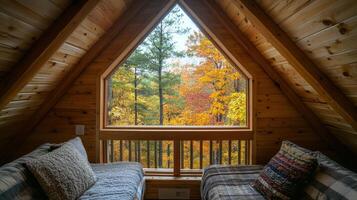 Autumnal cabin loft room with a forest view. photo