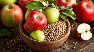 Fresh apples and mung beans in a wooden bowl. photo