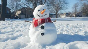 A delightful snowman adorned in a red and white scarf. photo