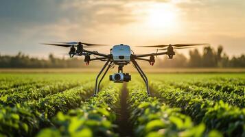 Agricultural drone hovering over a field of crops at sunset. photo