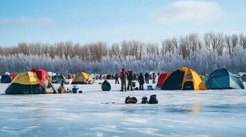 Colorful tents on a frozen lake, frosty winter scene. photo