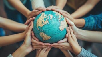 Hands holding a globe, representing global unity. photo