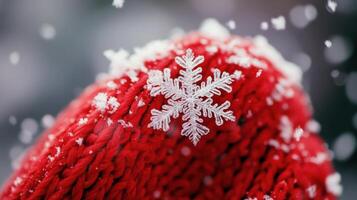 Detailed close-up of a snow-covered red knitted winter hat. photo