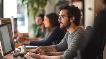 Focused group of people working at computers in a modern office. photo