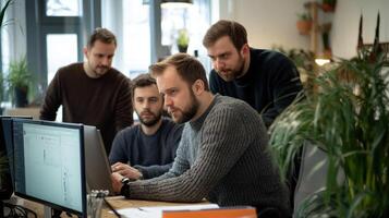 Focused team of colleagues collaborating on a project in a bright office. photo