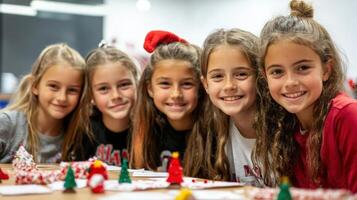 Group of cheerful young girls in holiday attire. photo