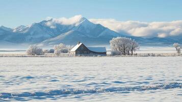 Winter wonderland scene with a rustic farm house and snow-capped mountains. photo
