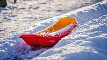 Winter sled resting on a snow-covered path. photo