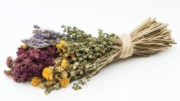 Dried herbs tied together in a colorful bunch. photo