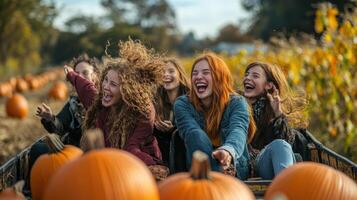 A group of happy children laughing in a pumpkin patch. photo