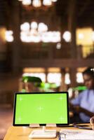 Black medical scholar reviewing case files in the library next to chroma key screen, preparing for a lecture or study session on medical practices. Med school pupil learns for a career. Close up. photo