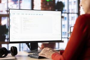 Person typing into an AI chatbot system to automate her workflow at home office, uses the web virtual assistant for smart automation and real time solutions. The power of artificial intelligence. photo