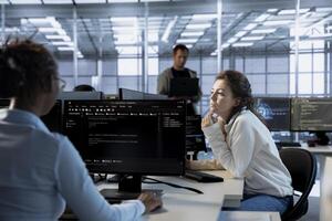 Data center computer scientist developing disaster recovery plans ensuring minimal downtime. Server room employee uses data analytics to monitor performance and predict future infrastructure needs photo
