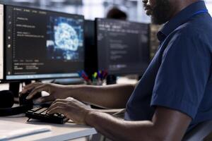 Software developer reconfiguring neural networks server farm to optimize it for data processing requirements. Machine learning specialist ensuring data center operates efficiently photo
