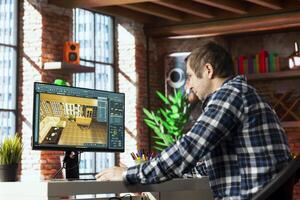 Architect using virtual home interior design software to help visualize changes to designs. Man using architectural design software to plan, research, coordinate and manage home enhancement project photo
