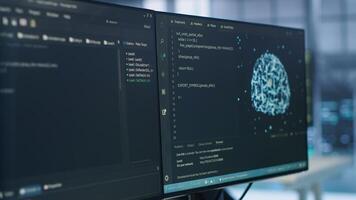 PC displays in data center providing computing resources for artificial intelligence processing massive datasets for training. Close up of code lines on computer in server room for machine learning photo
