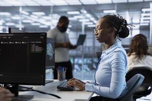 Technician in server room implementing power management solutions to reduce energy consumption. IT professional integrating new technologies and systems in data center workspace photo