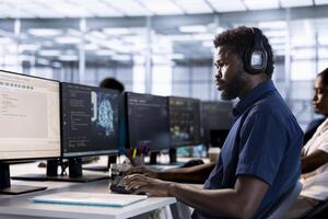 Server room employee listening music, creating high performance AI systems on PC. Admin in data center wearing headphones to hear songs, developing artificial intelligence photo