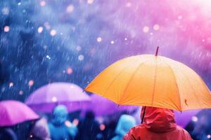 Crowd enjoying summer festival despite rain with colorful umbrellas and vibrant raincoats photo