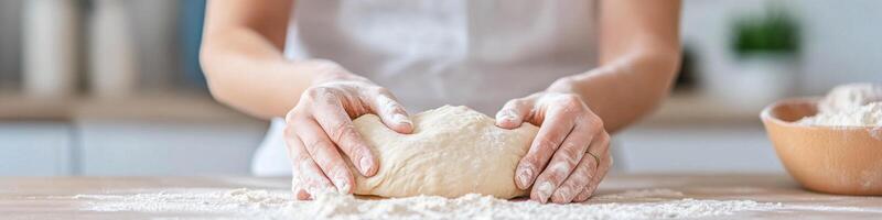 Hands shape dough on countertop showcasing the art of baking with texture and care photo