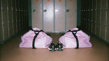 Surprising moment in soccer locker room rat sneaks among gym bags and cleats creating unexpected disruption photo